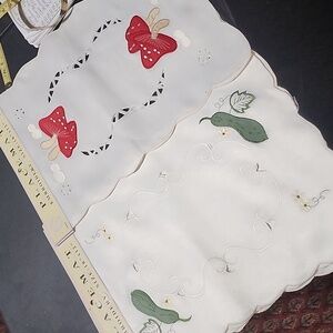 NEW WITH  TAGS . SET OF 7 PLACEMATS.  EMBROIDERY.